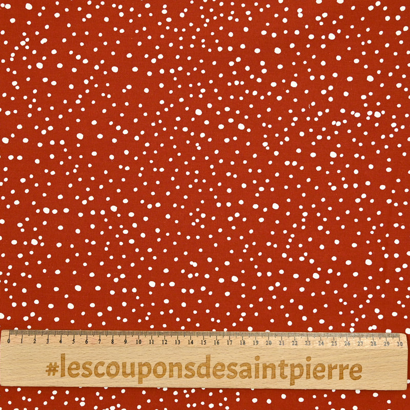 Popeline de coton imprimée confettis fond brique