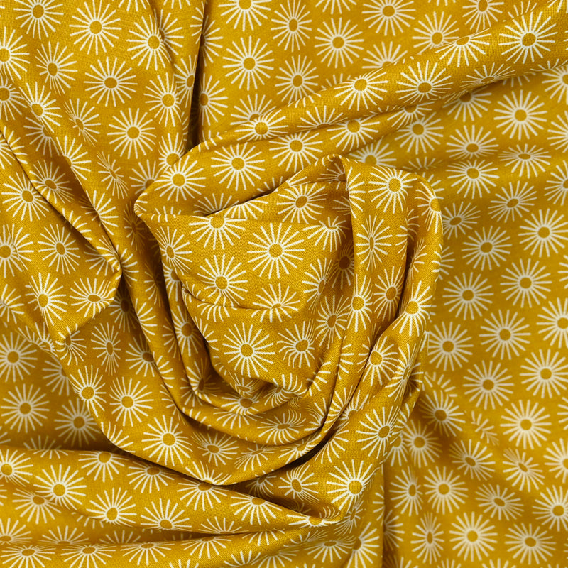 Popeline de coton imprimée soleil fond moutarde