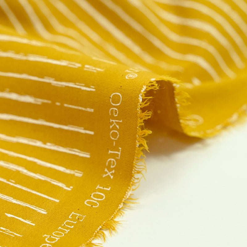 Popeline de coton imprimée rayée fond moutarde