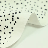 Popeline de coton imprimée confettis fond blanc