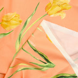 Coton imprimé tulipe jaune fond orange