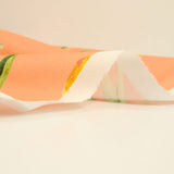 Coton imprimé tulipe jaune fond orange