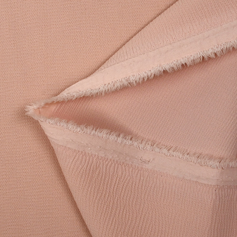 Double crêpe de polyester rose poudré