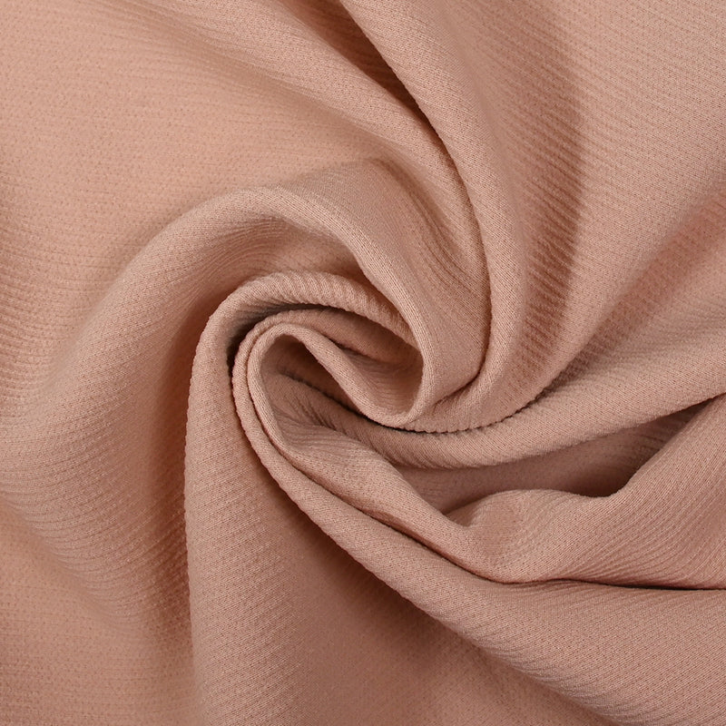 Double crêpe de polyester rose poudré