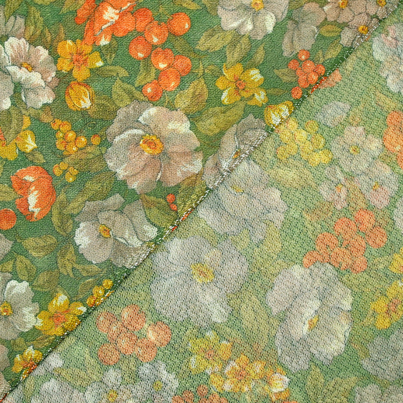 Maille polyester lamé fleurs orange et vert fond vert prairie