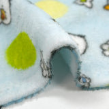 Fleet comforter printed with flowers and ducklings on a sky blue background