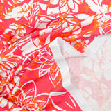 Jersey de viscose imprimé splash et fleurs fond rose