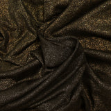 Jersey de viscose fin irisé doré fond noir