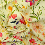 Viscose imprimée pluie de fleurs fond jaune pâle
