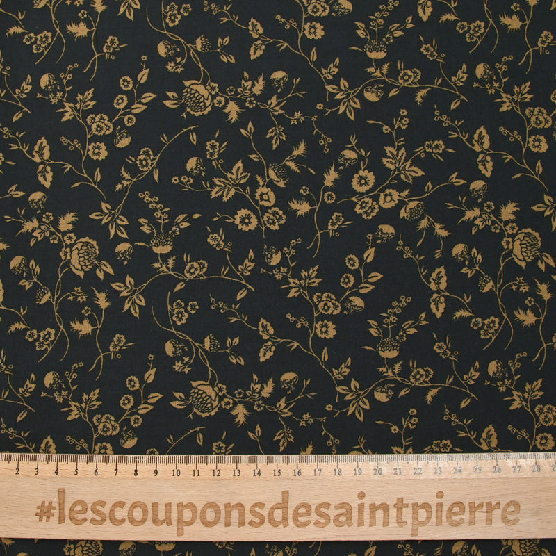 Voile de viscose imprimé branches de fleurs ocre fond noir