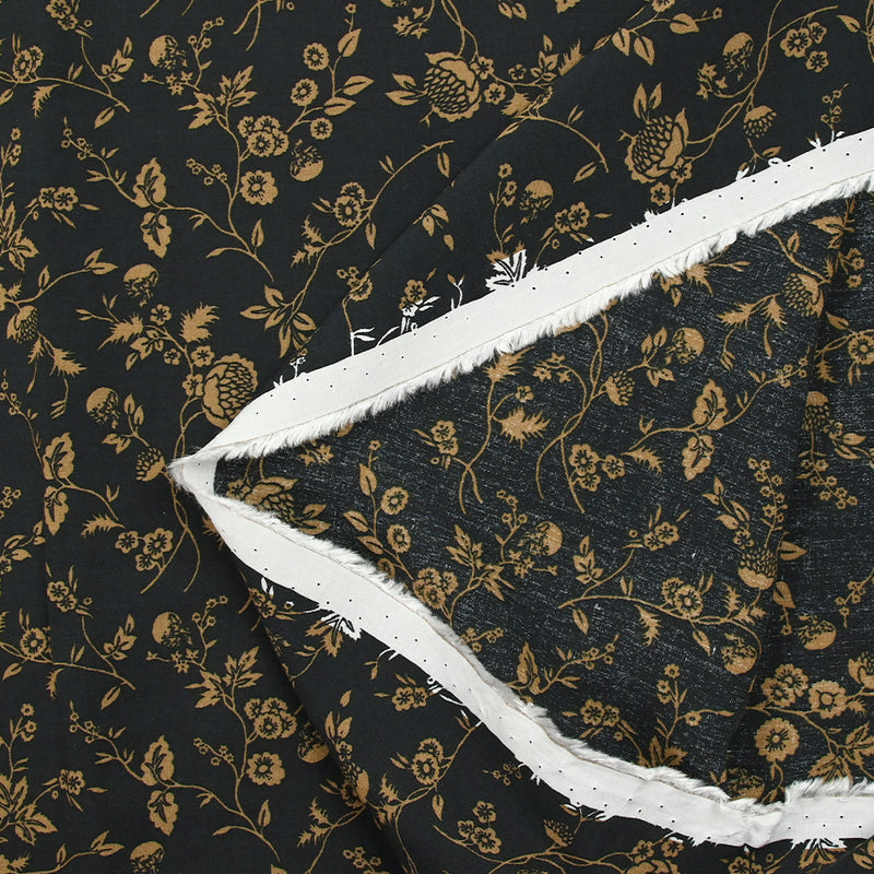 Voile de viscose imprimé branches de fleurs ocre fond noir