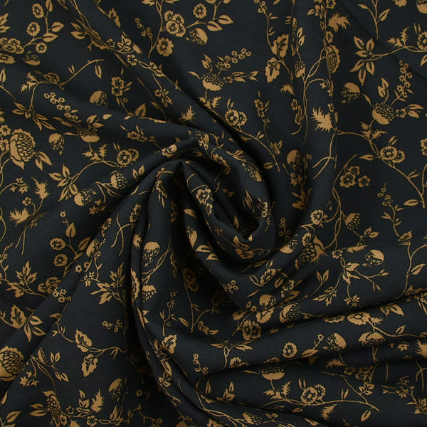 Voile de viscose imprimé branches de fleurs ocre fond noir