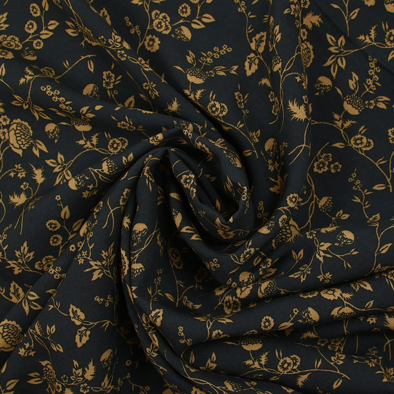 Voile de viscose imprimé branches de fleurs ocre fond noir