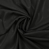 Crêpe de polyester fin pailleté ton sur ton fond noir