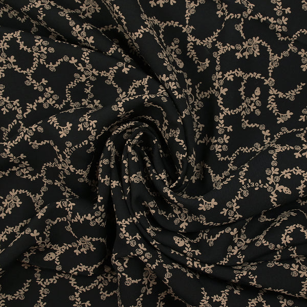 Viscose imprimée chaîne de fleurs fond noir