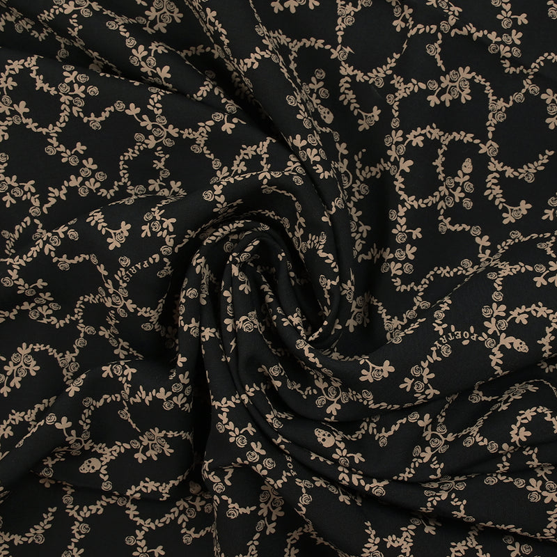 Viscose imprimée chaîne de fleurs fond noir