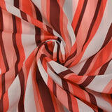 Polyester voile printed with coral, off-white and mahogany stripes