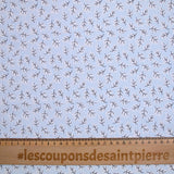 Popeline polycoton imprimée rayée et branche fond bleu