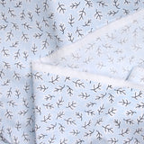 Popeline polycoton imprimée rayée et branche fond bleu