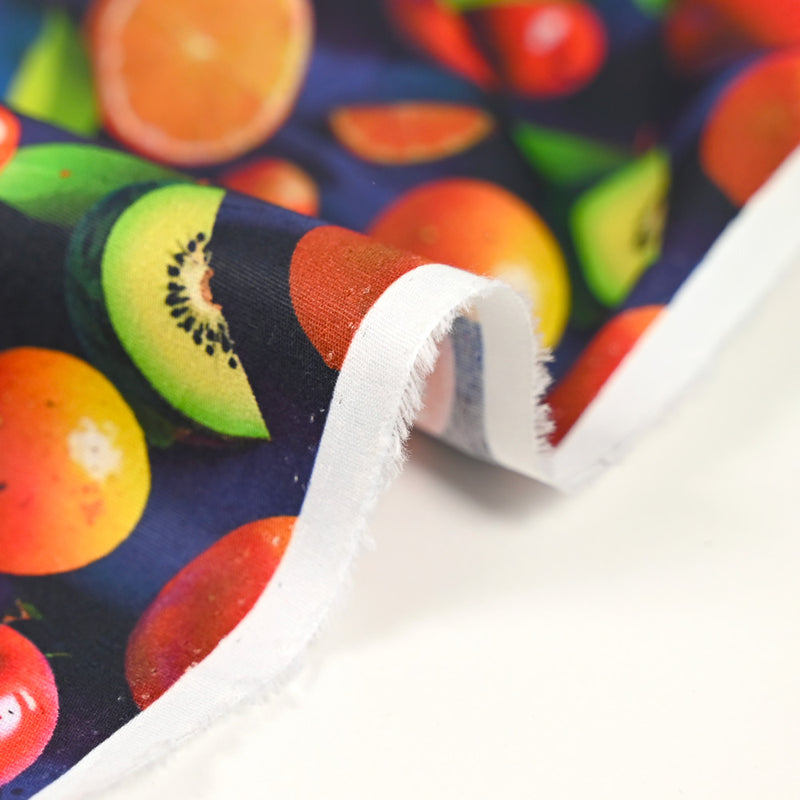 Coton imprimé multifruit fond bleu