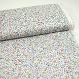 Coton imprimé Aurora fleurs rose et jaune fond blanc au mètre