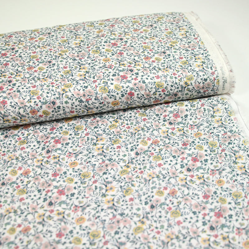 Coton imprimé Aurora fleurs rose et jaune fond blanc au mètre