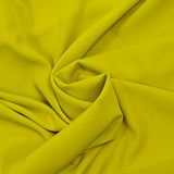 Crêpe polyester élasthanne moutarde
