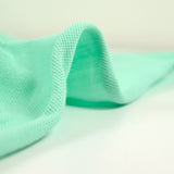 Camisa de polo de algodón verde de agua