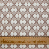 Popeline enduite imprimée pois & trèfle blanc fond marron glacé