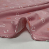Jersey tout doux imprimé petits cœurs fond rose
