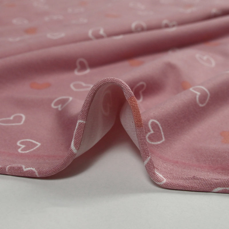 Jersey tout doux imprimé petits cœurs fond rose