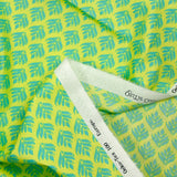 Popeline enduite imprimée végétal turquoise fond citron