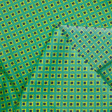 Popeline enduite imprimée fleur losange citron fond vert