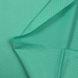 Coton imprimé mini pois fond turquoise