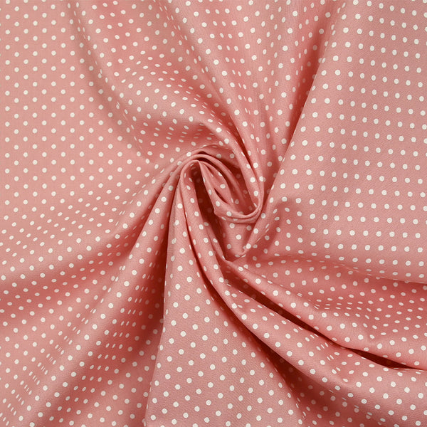 Coton imprimé pois 2mm fond rose clair