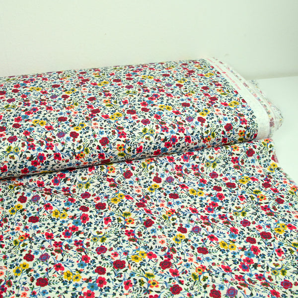 Coton imprimé Aurora fleurs rouge et jaune fond blanc au mètre
