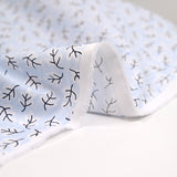 Popeline polycoton imprimée rayée et branche fond bleu