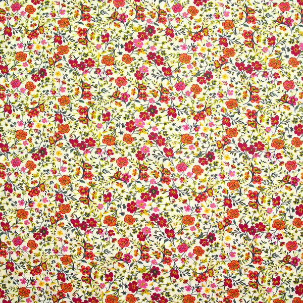 Coton imprimé Greta fleurs fuchsia et orange fond blanc au mètre