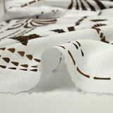 Coton tissé aspect lin imprimé palmiers ondulés fond blanc