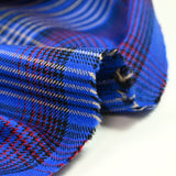 Red and beige checked wool, blue background
