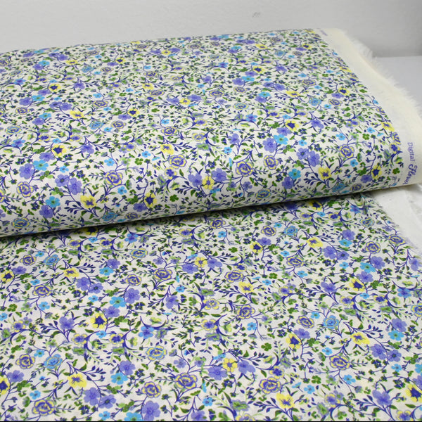 Coton imprimé Giorgia fleurs violet et bleu fond écru au mètre