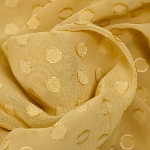 Crêpe Georgette viscose with jacquard golden polka dots