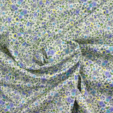 Coton imprimé Giorgia fleurs violet et bleu fond écru au mètre