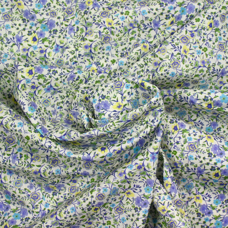 Coton imprimé Giorgia fleurs violet et bleu fond écru au mètre