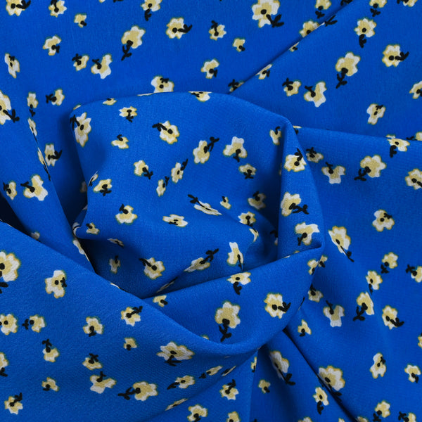 Crêpe de polyester imprimé petites fleurs fond bleu roi