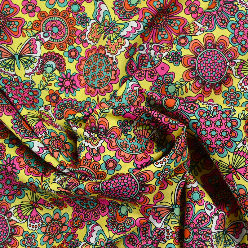 Coton imprimé papillon fuchsia fond jaune au mètre
