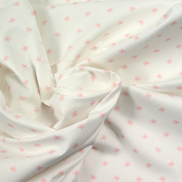 Coton imprimé noeud rose fond blanc