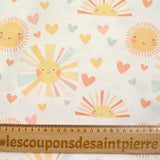 Coton imprimé soleil fond blanc cassé