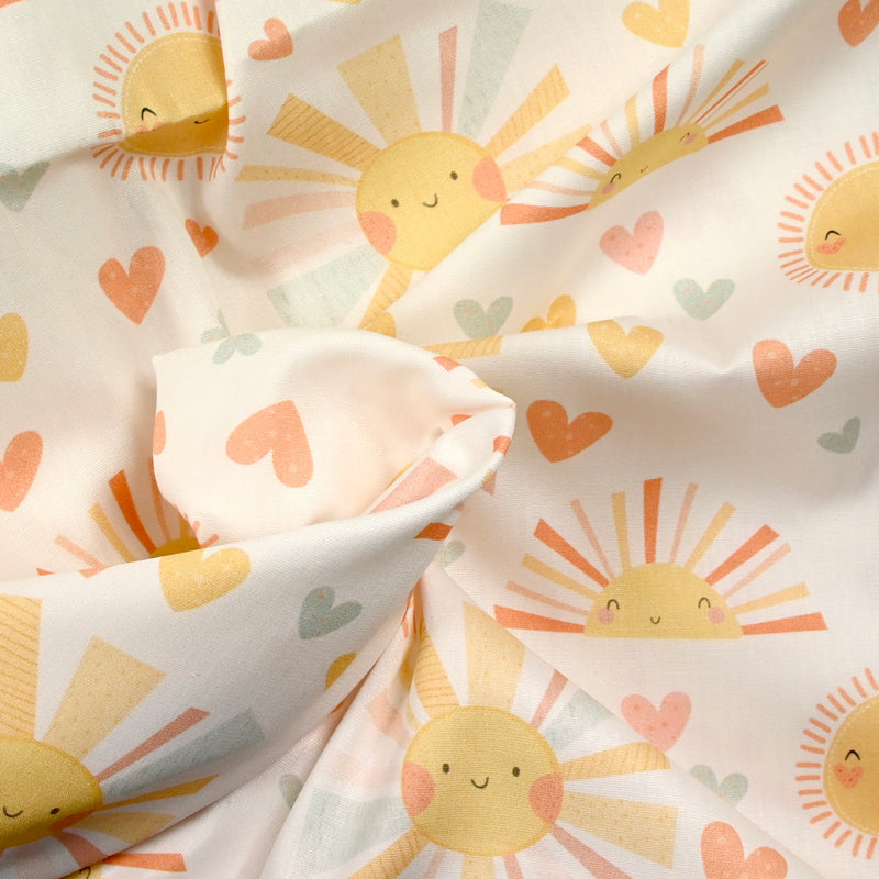Coton imprimé soleil fond blanc cassé