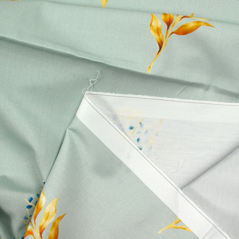 Coton imprimé branche fond gris bleu